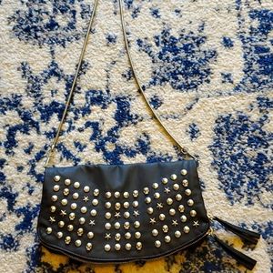 Skull and star studded handbag